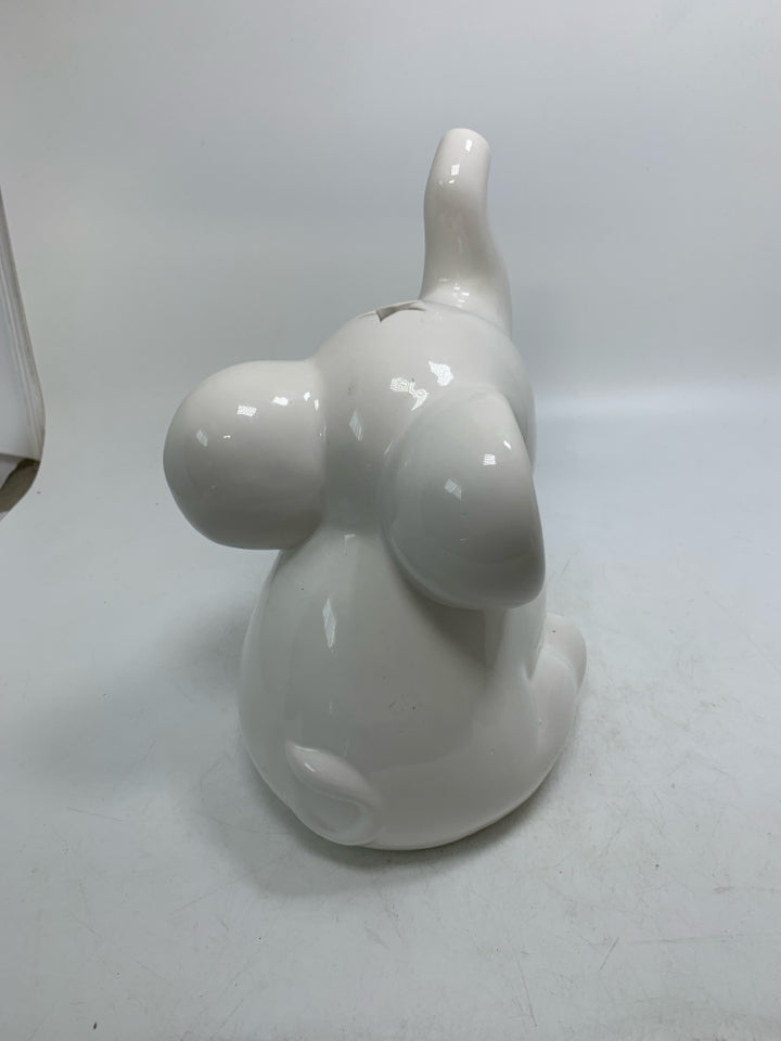 WHITE CERAMIC SITTING ELEPHANT W/ PIERCED STARS.