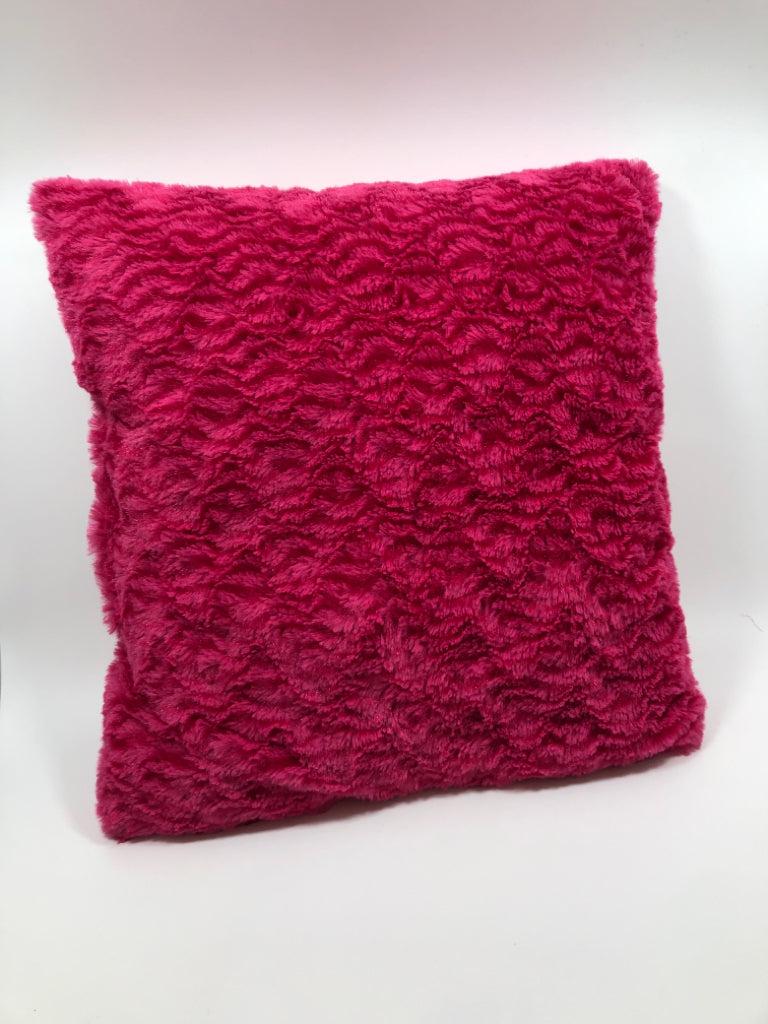 FUZZY PINK THROW PILLOW.