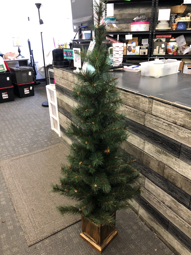 FAUX XMAS TREE IN GOLD PAINTED PLANTER.
