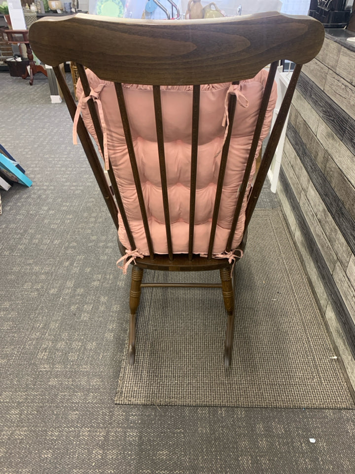 MEDIUM WOOD ROCKING CHAIR WITH GOLD FLOWER DESIGN.