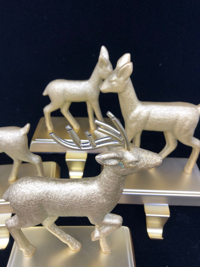 4 GOLD DEER STOCKING HOLDERS.