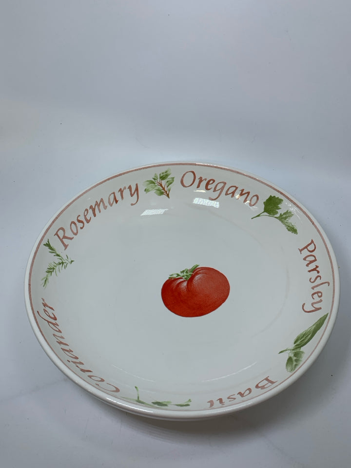LARGE PASTA BOWL W/ TOMATO IN CENTER W/ HERB THEMED BOARDER.
