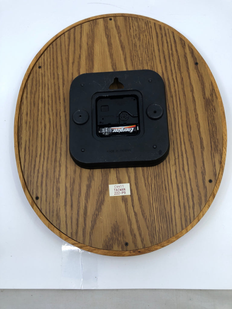 OVAL WOOD BULOVA CLOCK.