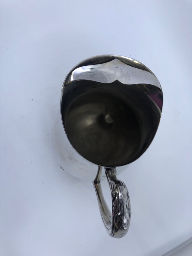 VTG SILVER FOOTED PITCHER W ICE LIP.