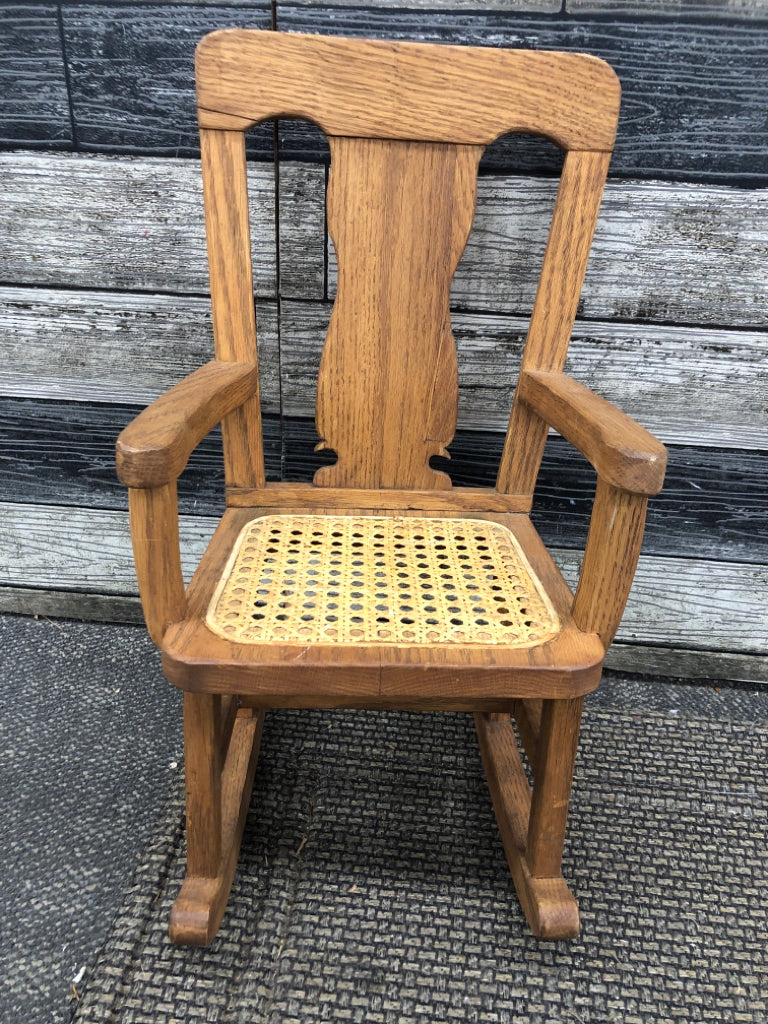 WOOD DOLL ROCKING CHAIR W/CANE SEAT.