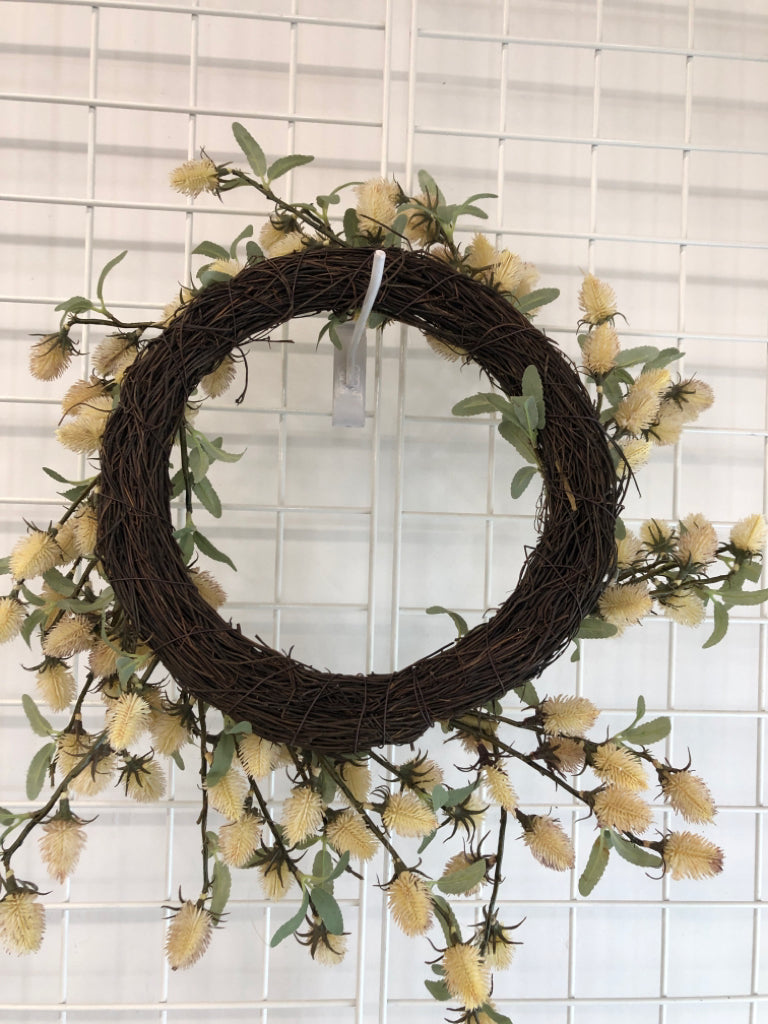 CREAM THISTLE BLOOMS W/GREEN LEAVES WREATH.