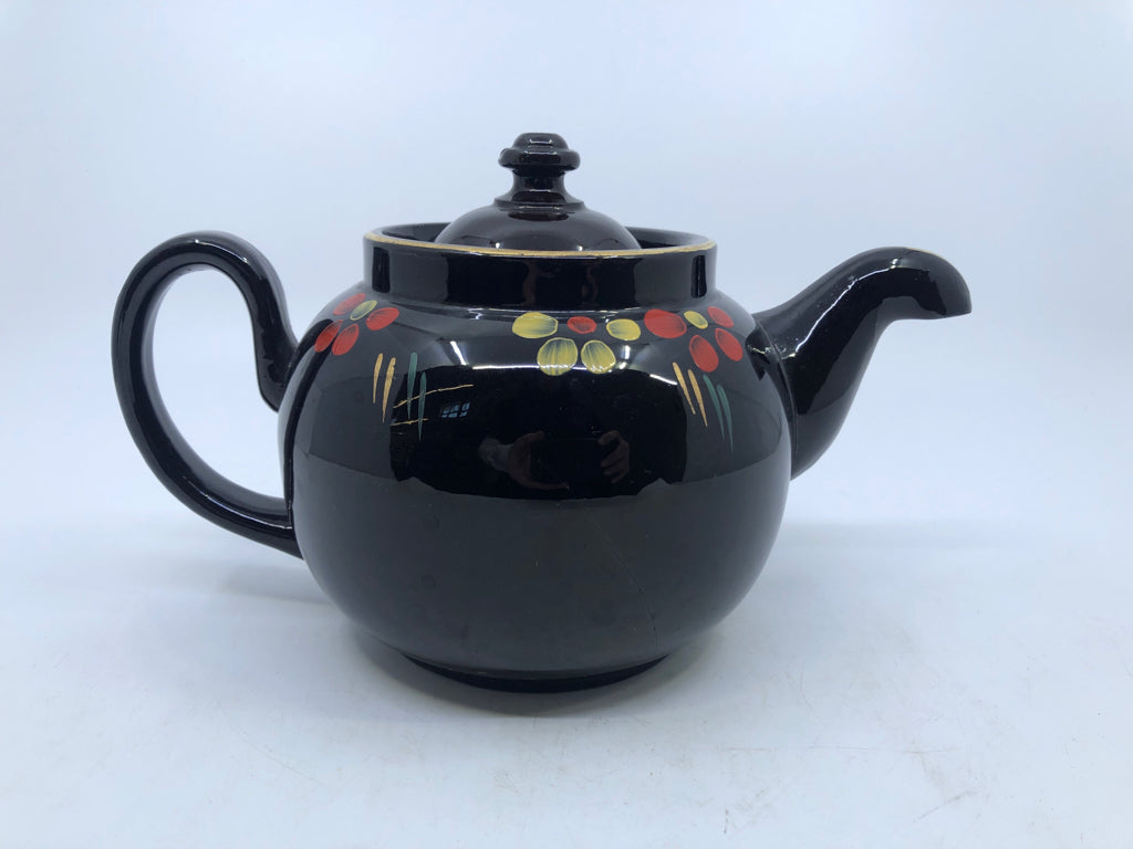 VTG BROWN CERAMIC TEAPOT W/RED & YELLOW FLOWERS.