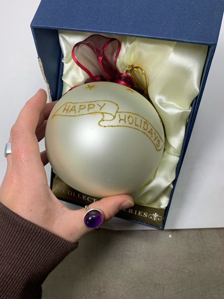 LARGE WHITE ORNAMENT W/ SANTA WALKING REINDEER IN BOX.