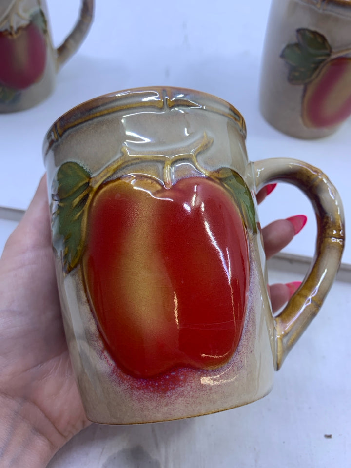 4 TAN CERAMIC EMBOSSED APPLES MUGS.
