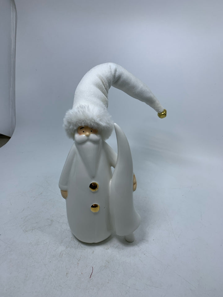 CERAMIC WHITE SANTA HOLDING TREE W/ W/ FABRIC HAT.