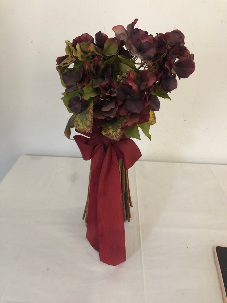 MAROON COLORED FAUX FLOWERS W RED BOW.