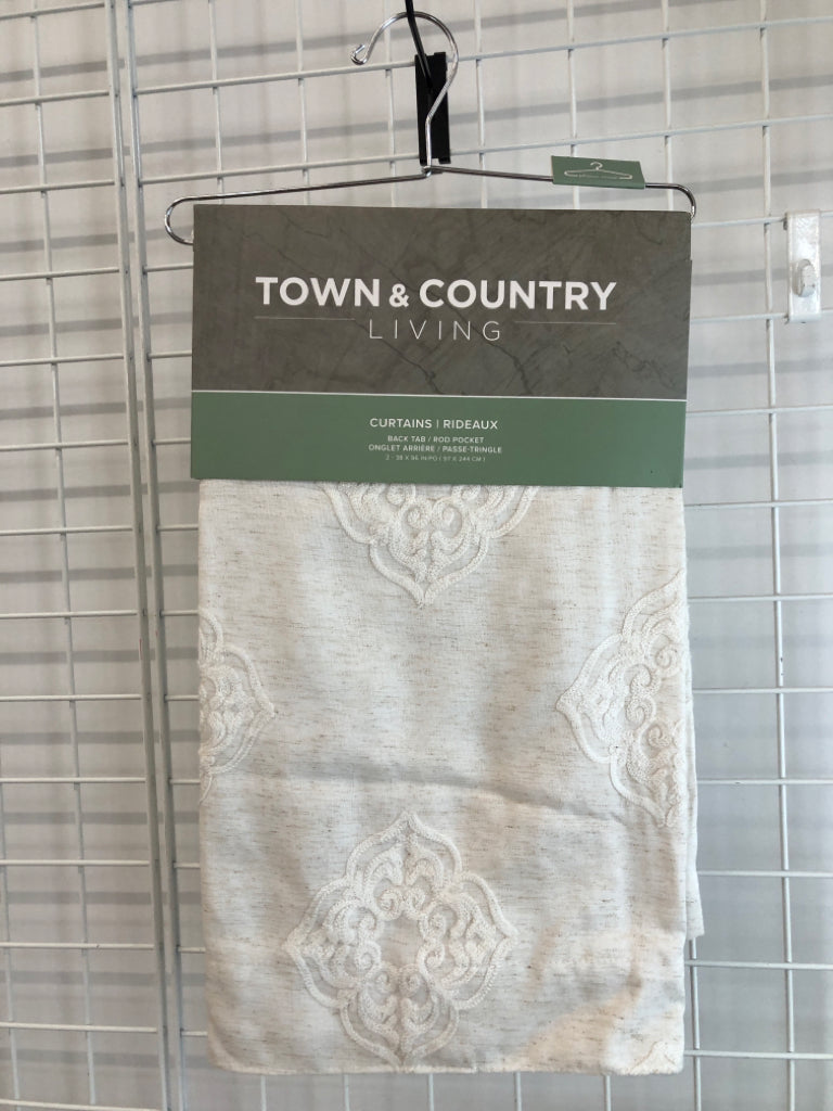 NIP 2PK CREAM BACK TAB CURTAINS.