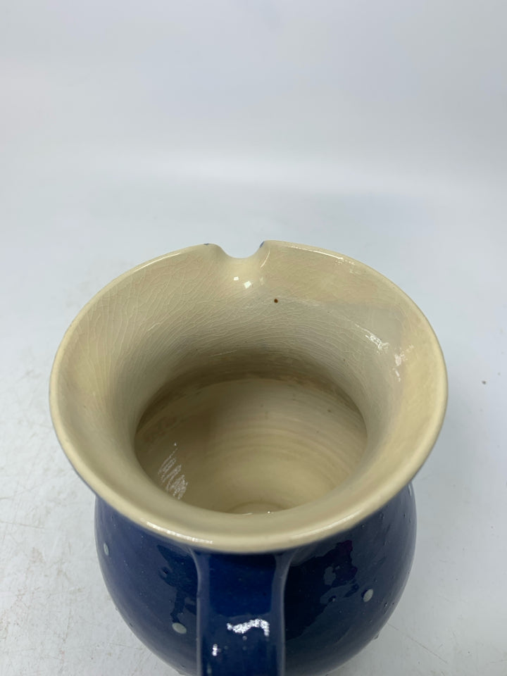 DARK BLUE CREAMER W/ PAINTED FLOWERS.