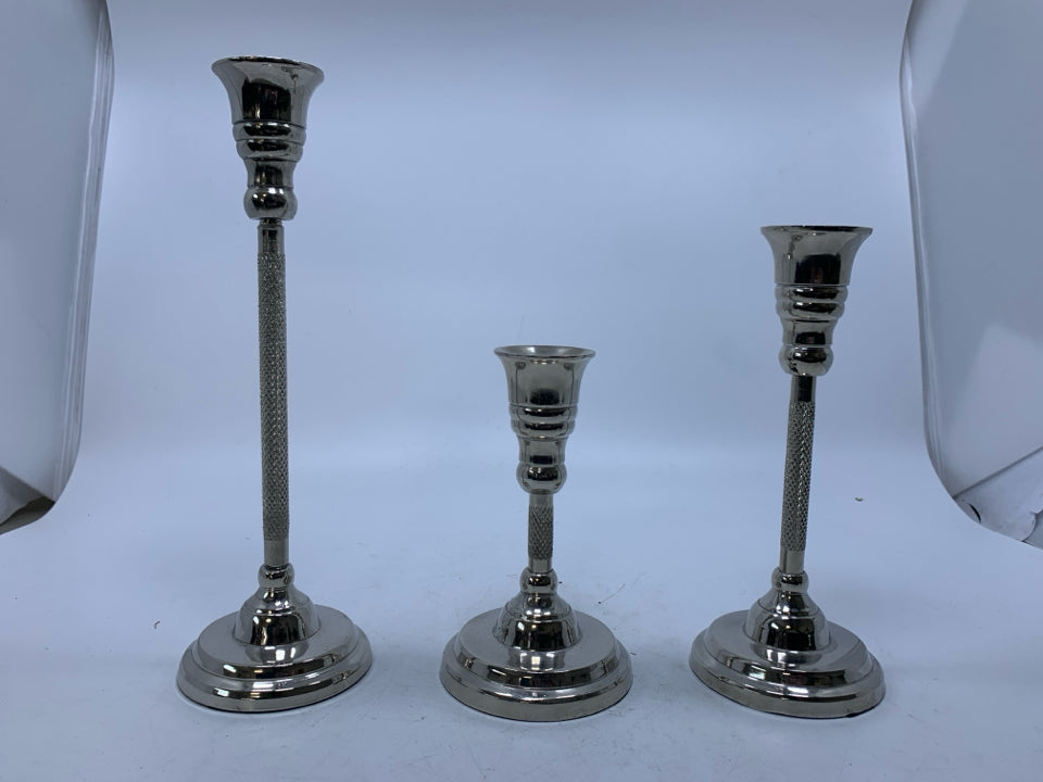 3 SILVER METAL TAPERED CANDLE HOLDERS.