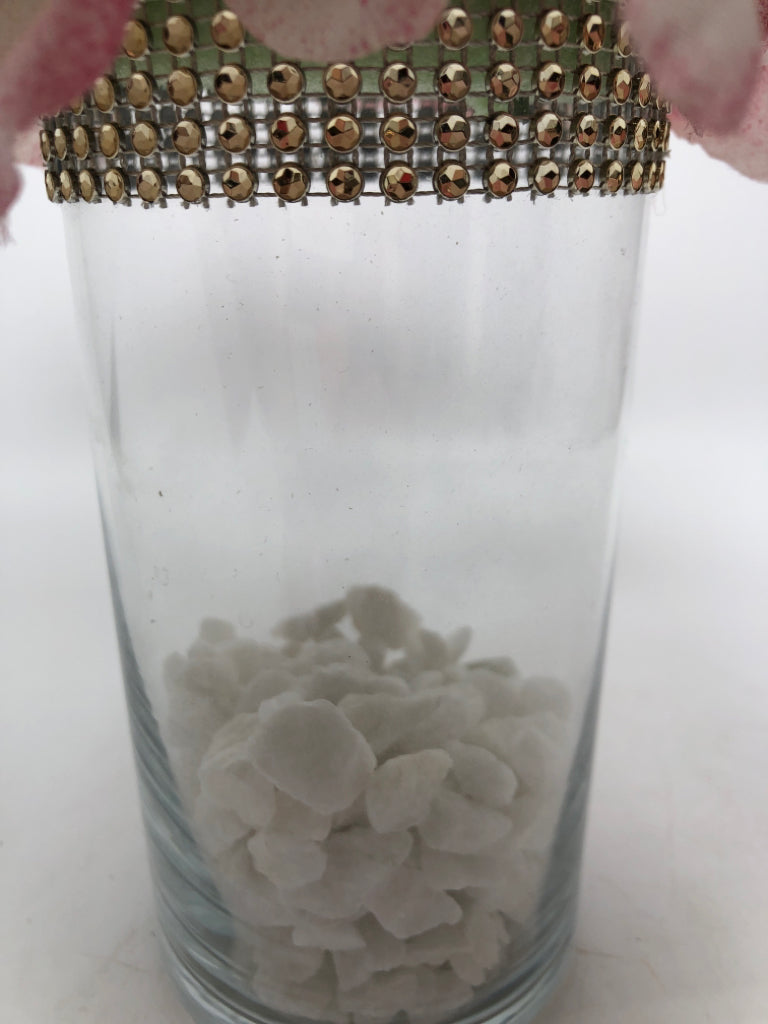 WHITE ROCK FILLED VASE W/PINK FLORALS.