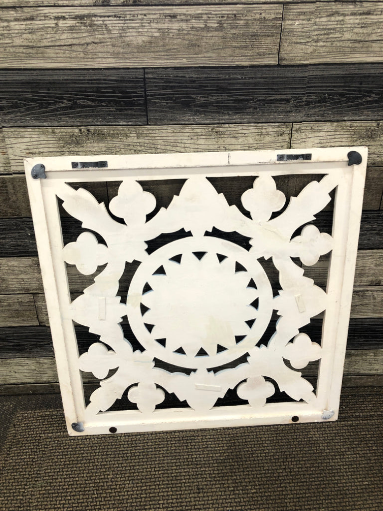WHITE WOODEN FLORAL WALL HANGING W/BLUE MEDALLION.