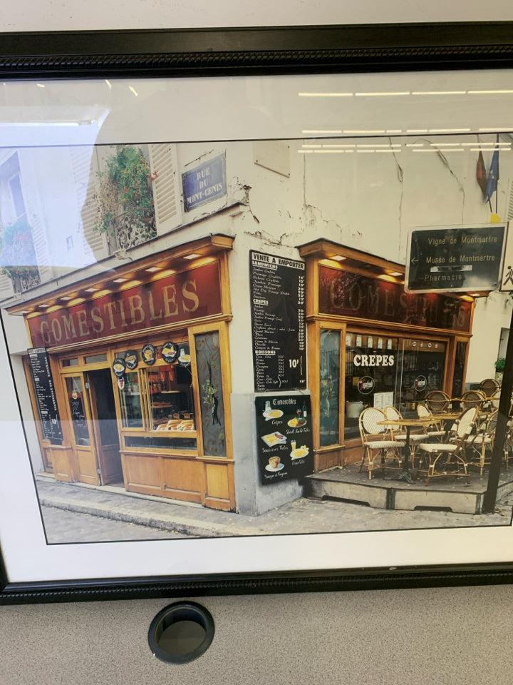 COMESTABLES CAFE FRONT IN BLACK FRAME.