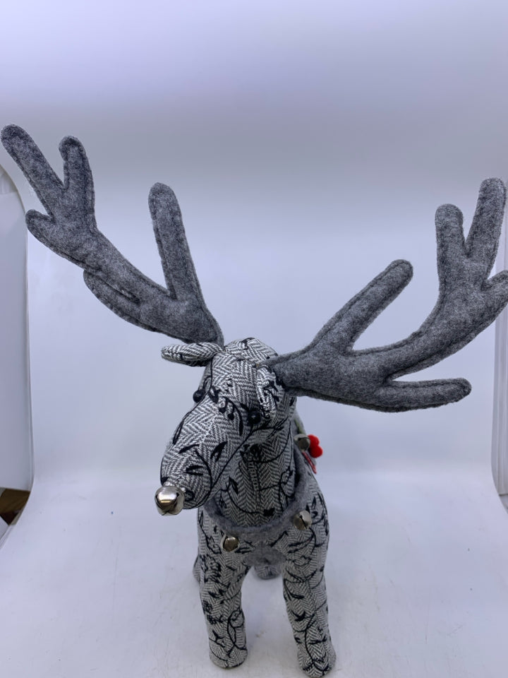 GREY W/ EMBROIDERED BLACK FLOWERS STANDING REINDEER PLUSH.