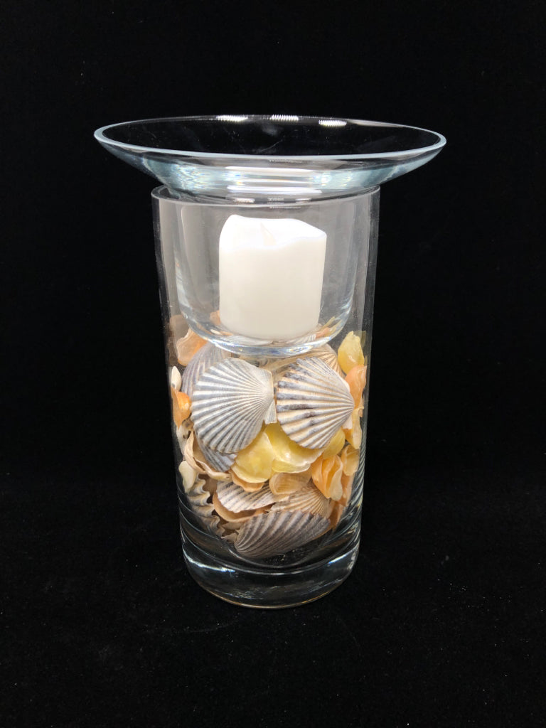 SEASHELL FILLED GLASS CANDLE HOLDER.