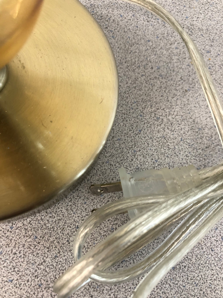 GOLD CLEAR GLASS LAMP W/FOLDED CREAM SHADE.
