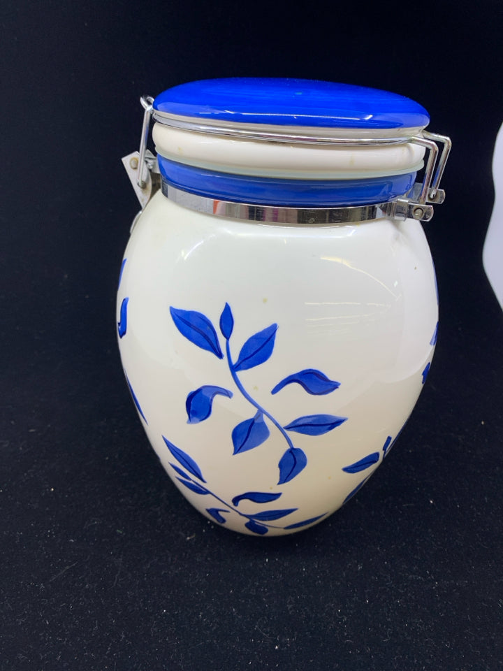 BLUE AND WHITE COOKIE JAR W METAL CLASP.