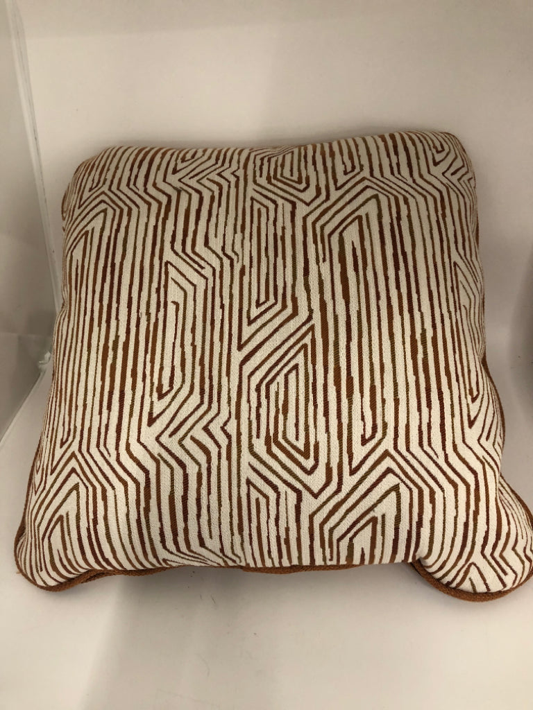 ORANGE AND CREAM ZIGZAG PILLOW.