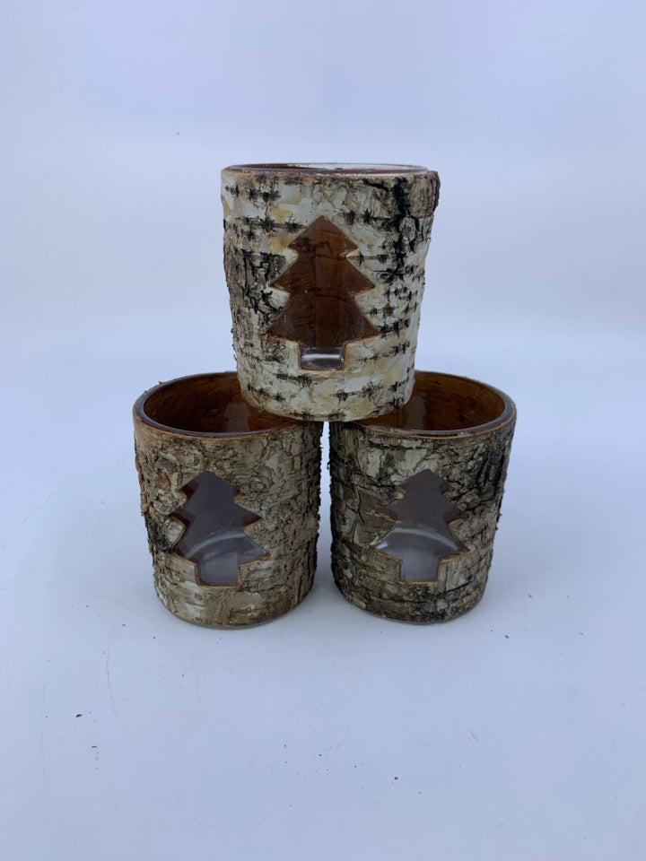 3 TREE BARK COVERED TEA LIGHT HOLDERS W/ TREE CUTOUT.