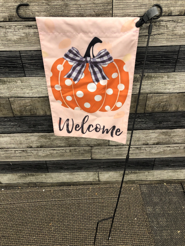 "WELCOME" PUMPKIN FLAG ON POLE.