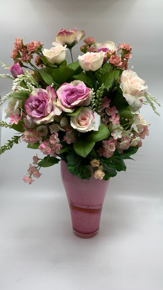 FAUX PINK ROSES IN PINK GLASS VASE.