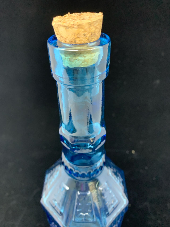 SMALL DECORATIVE BLUE GLASS BOTTLE W/CORK STOPPER.