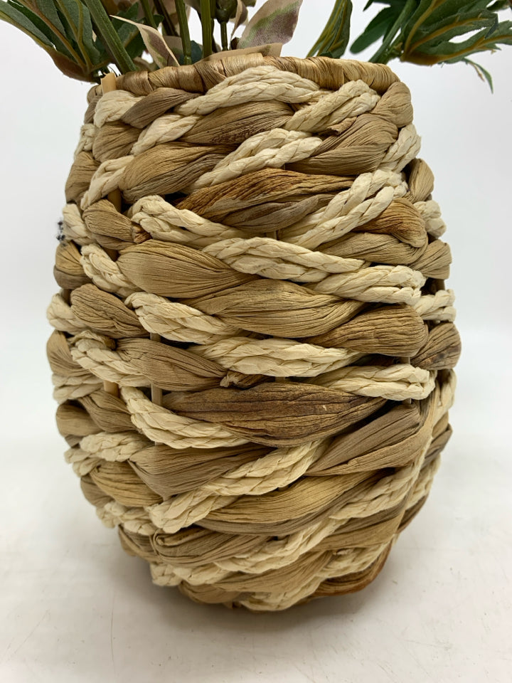 FLORAL MIX IN WICKER VASE.