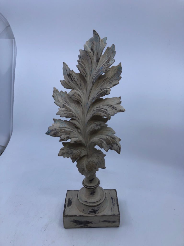 DISTRESSED TAN RESIN LEAF ON STAND.