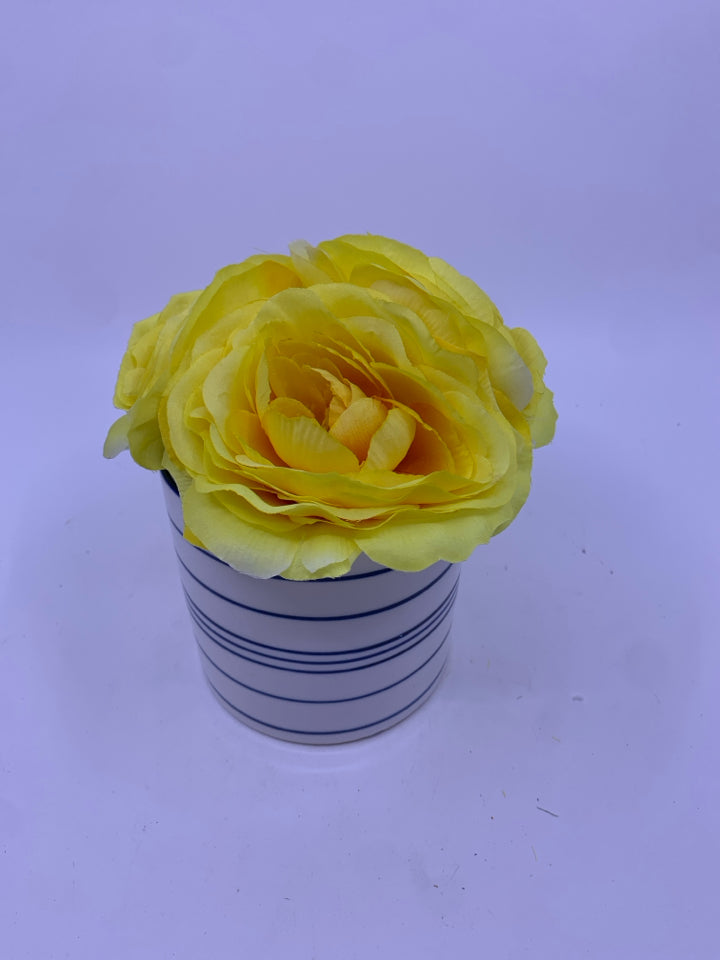 YELLOW FLORAL IN BLUE AND WHITE VASE.