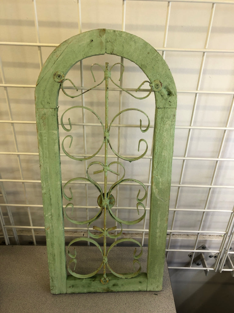 DISTRESSED GREEN PAINTED ARCH W/ METAL SCROLL WALL ART.