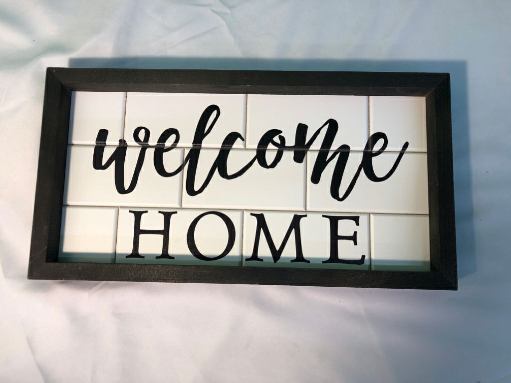 WELCOME HOME FAUX WHITE BRICK WALL ART W/ BLACK WOOD FRAME.