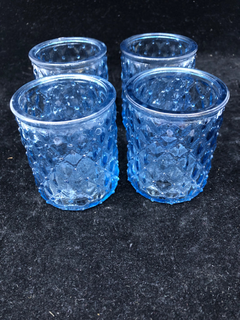 4 BLUE GLASS TEA LIGHT CANDLE HOLDERS.