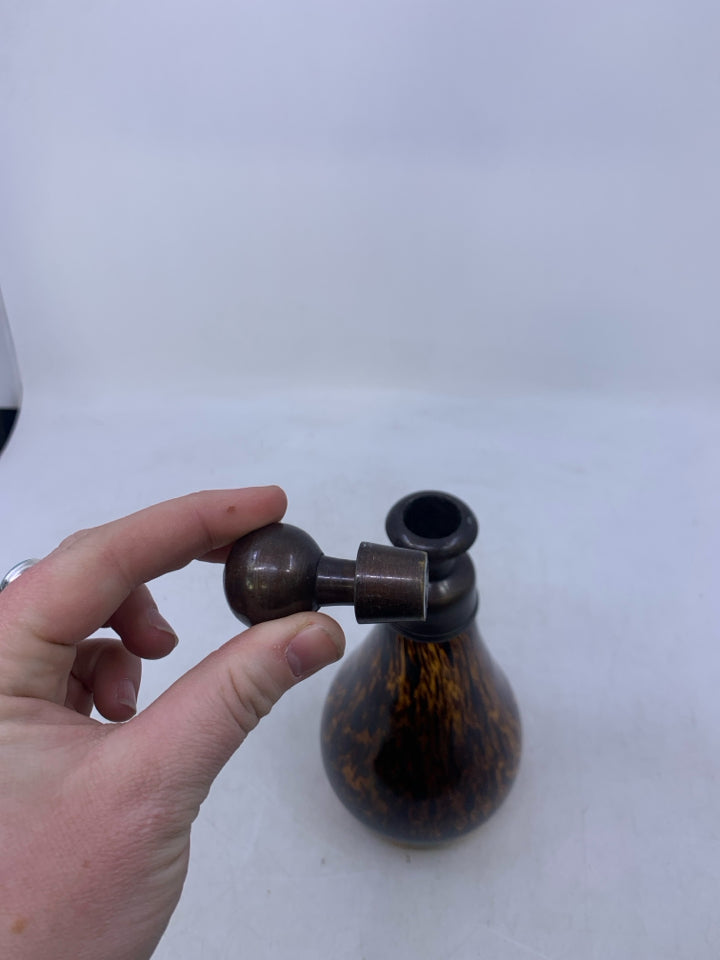 AMBER GLASS W/ LARGE BROWN SPOTS DECANTER W/ METAL STOPPER.
