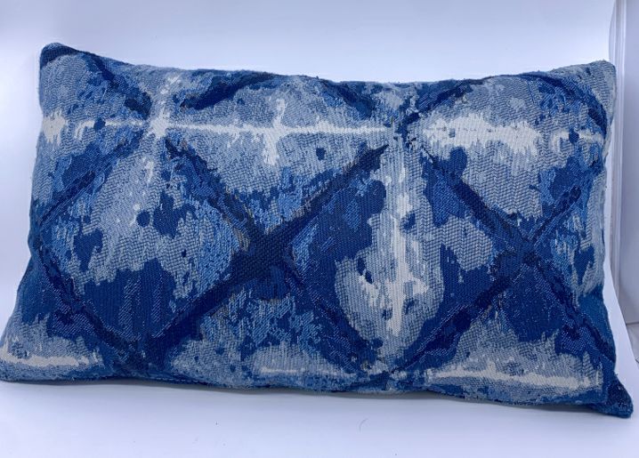 BLUE AND WHITE PATTERN RECTANGLE PILLOW.