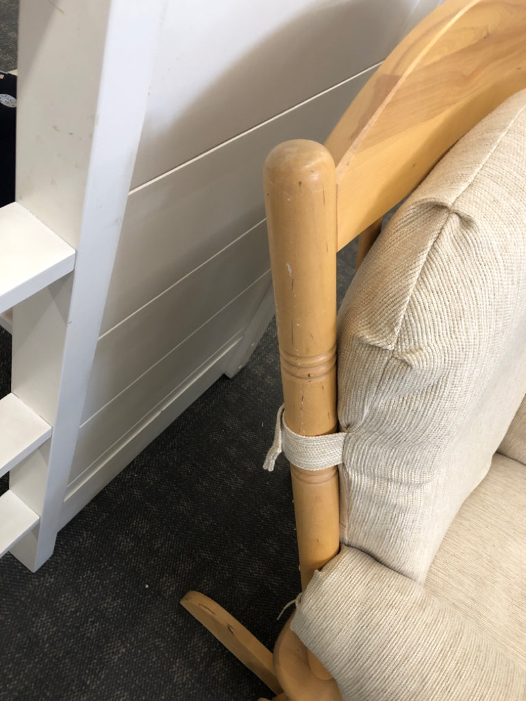 BLONDE WOODEN ROCKING CHAIR W/LEVER TO LOCK & BEIGE CUSHION.