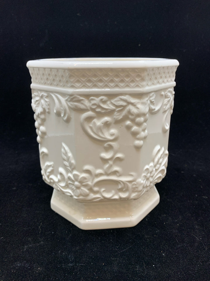 GRAPES EMBOSSED WHITE CERAMIC HEXAGON SHAPED PLANTER.