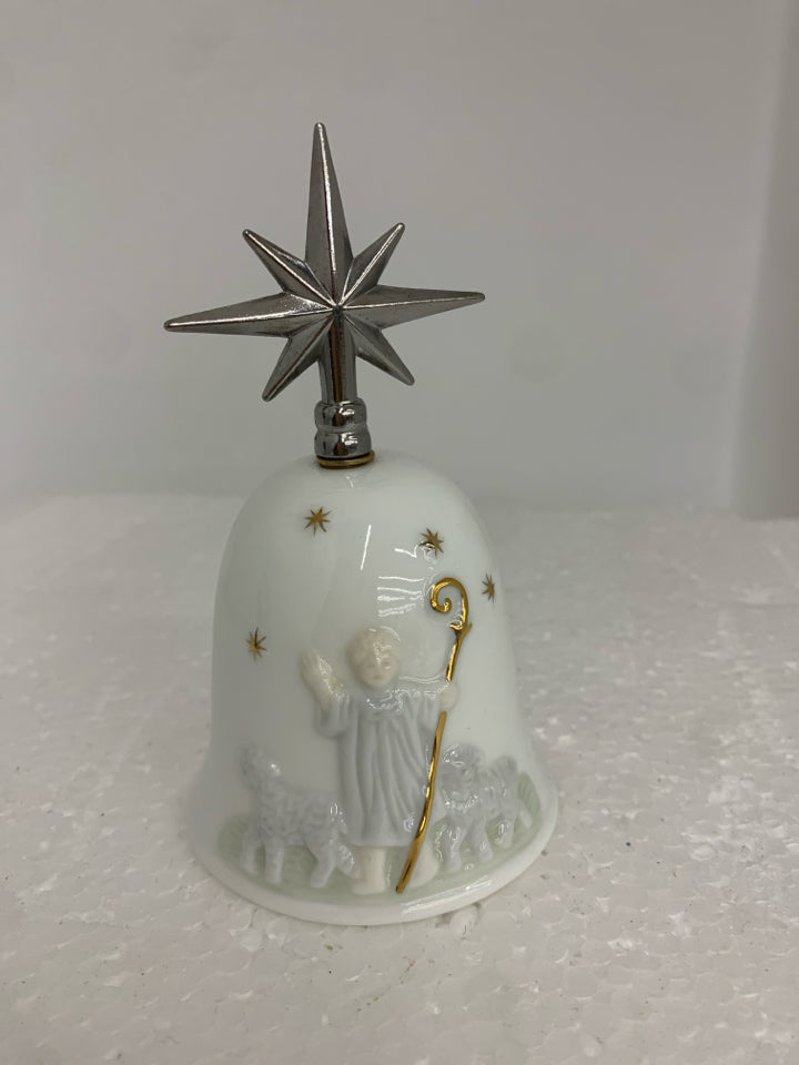 CERAMIC BELL W/ EMBOSSED BOY HERDING SHEEP METAL STAR AS HANDLE.
