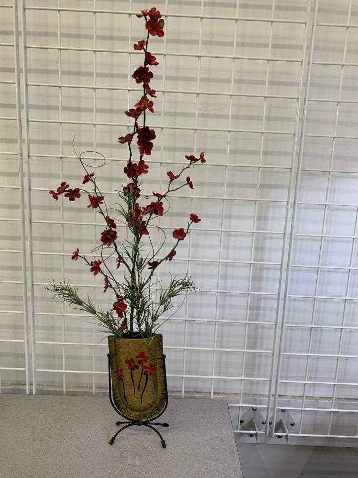 FAUX RED FLORALS IN POCKET VASE ON METAL STAND.