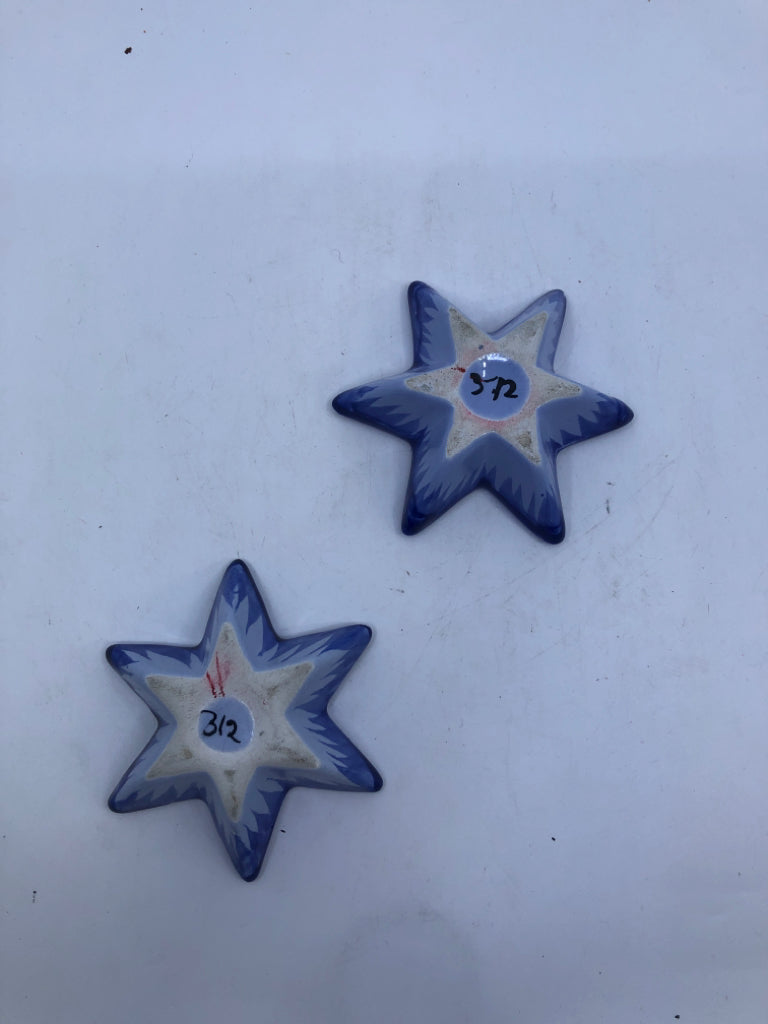 2 BLUE STAR CANDLE HOLDERS.