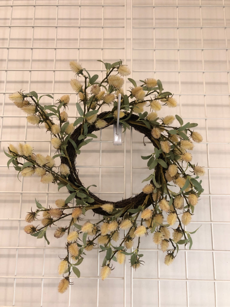 CREAM THISTLE BLOOMS W/GREEN LEAVES WREATH.