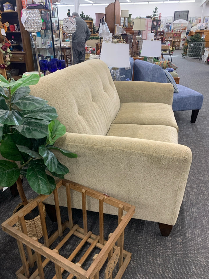 CREAM AND GREY ACCENT WOOD FOOTED LOVE SEAT.