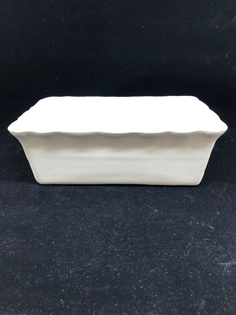 WHITE WAVY EDGE STONEWARE LOAF PAN.