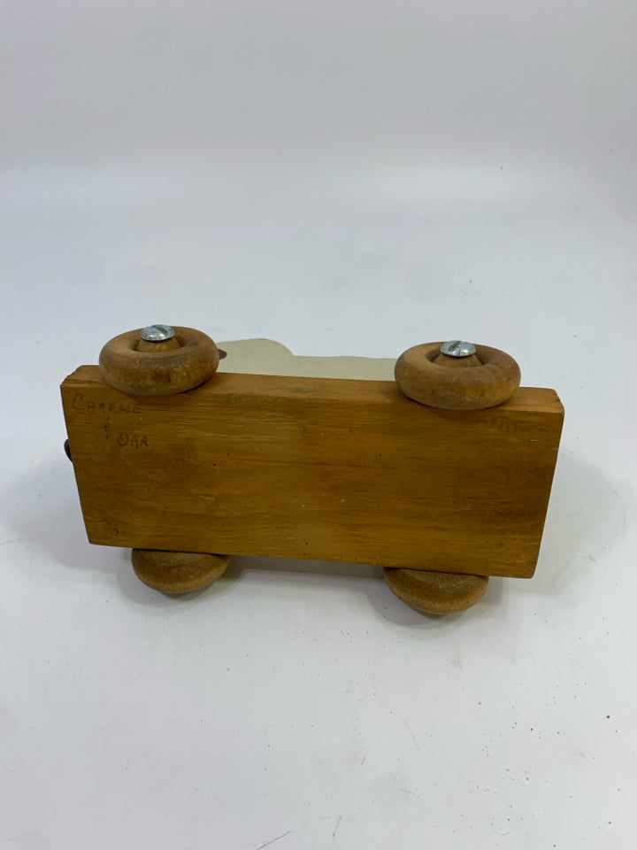 PRIMITIVE WOOD SHEEP ON WHEELS SHELF DECOR.