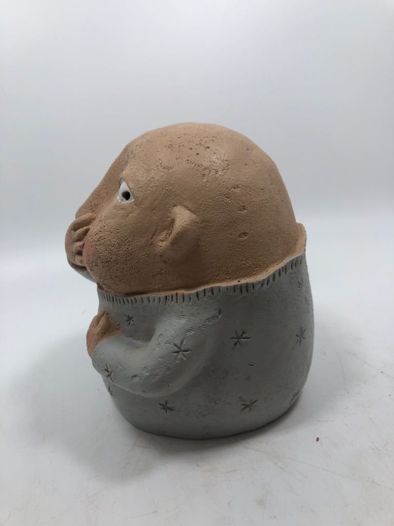 BOY HOLDING NOSE.
