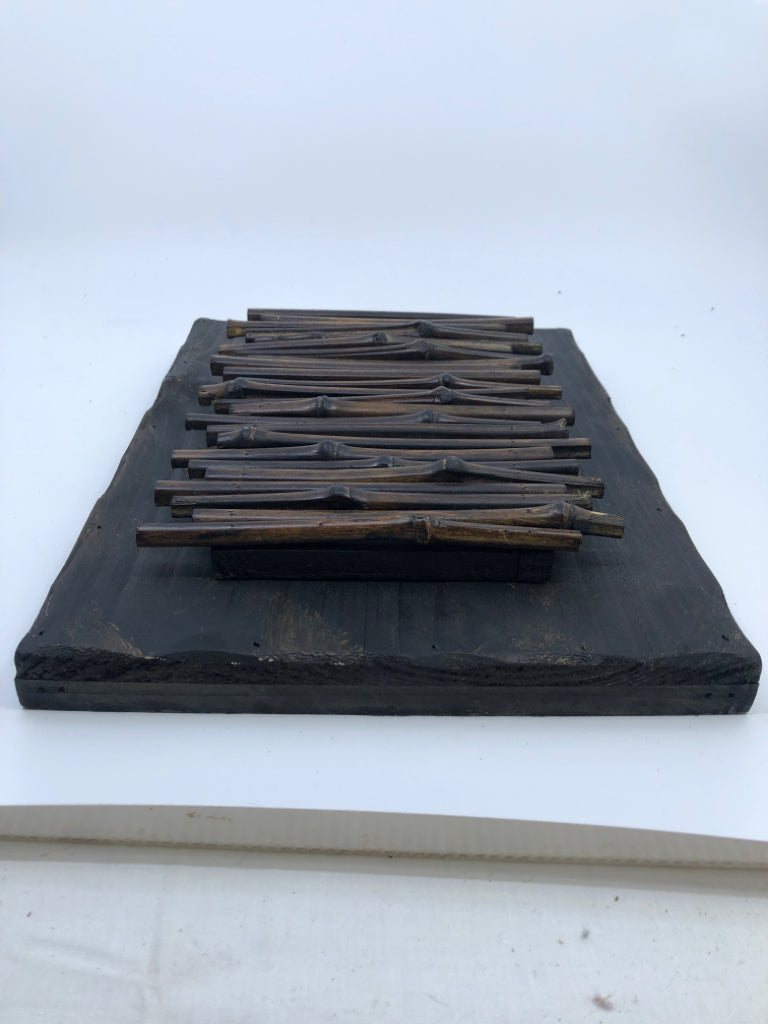 DARK WOOD BAMBOO STICKS WALL HANGING.