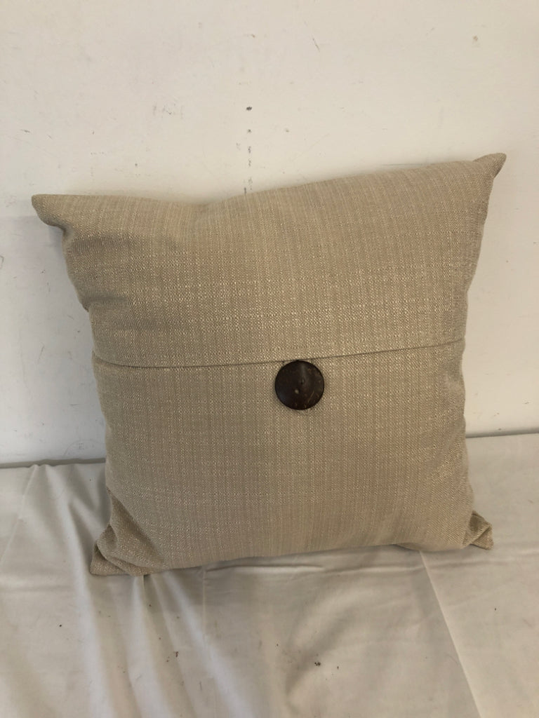 TAN PILLOW W BROWN BUTTON.